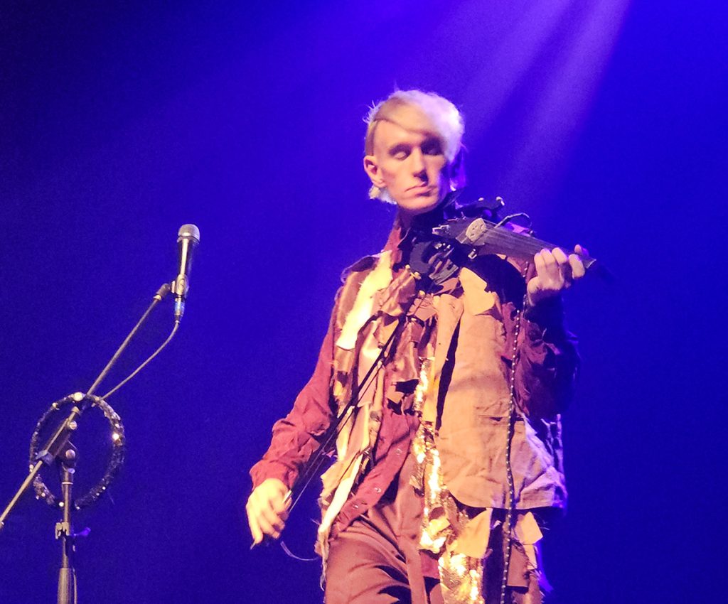 Patrick Wolf, playing an electric violin on stage